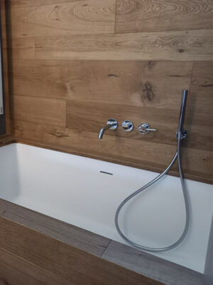 MOMA Design recessed bathtub in niche model Crystal Inca without backs, fully lined with wood