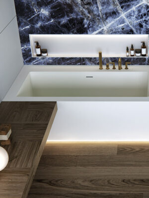 MOMA Design corner bathtub in Stonage, Crystal model without backsplashes, rim-mounted faucets and Container niche