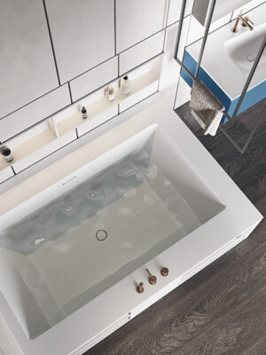 MOMA Design corner bathtub in Stonage, Miami model with two backsplashes, rim-mounted faucets and Container niche, with ceiling-mounted towel rack, Servetto model