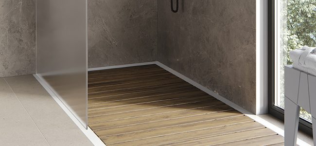 copertina2-mobile-one-shower-piatto-doccia-in-white-stonage piatto doccia ad angolo e a filo pavimento MOMA Design modello One Shower con doghe in teak, vetro fisso e sgabello Tangram