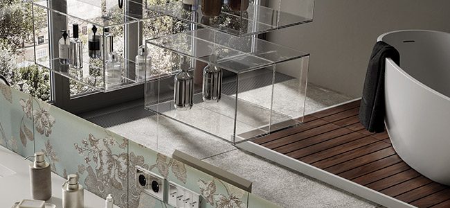 copertina2-mobile-ruby vasca freestanding in white stonage vasca freestanding in White Stonage modello Ruby di MOMA Design su pedana in legno Teak, riflessa in specchio modello Mirr UV Cube