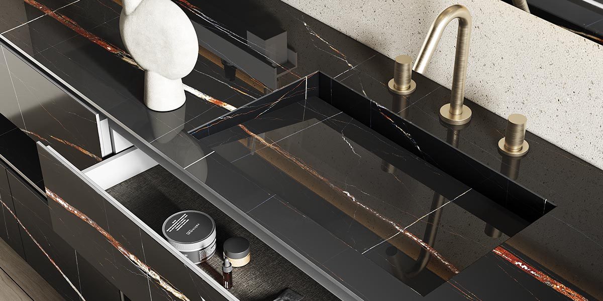 copertina2-tecno-inca-lavabo-da-sotto-top-in-white-stonage dettaglio lavabo da incasso sottotop MOMA Design modello Tecno Inca in gres Sahara Noir, montato su piano in gres in tinta e mobile modello Victoria nello stesso gres