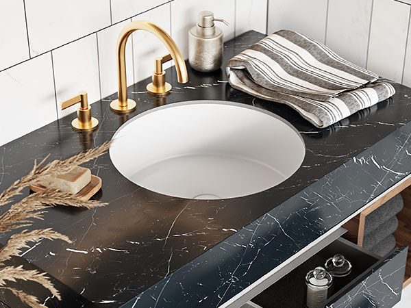 dettaglio-circle-inca-lavabo-da-sotto-top-in-white-stonage lavabo da incasso sottotop MOMA Design in stonage modello Circle Inca, montato su piano in gres finitura Elegant Black, mobile modello Victoria, cassetti aperti e vista dall'alto