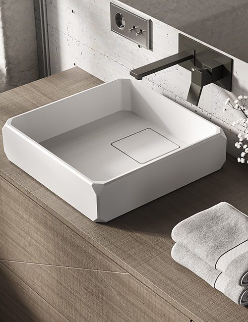 dettaglio-keplero-1-lavabo-da-appoggio-in-white-stonage Dettaglio lavabo d'appoggio MOMA Design modello Keplero con copripiletta removibile, in appoggio su mobile a terra modello Boxline