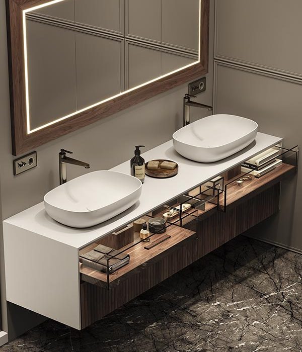 dettaglio3-slimline-mobile-con-profilo-frontale-sottile-con-top-e-alti-in-white-stonage-con-ante-e-cassetti-con-maniglia-a-gola-superiore-a-45° mobile sospeso MOMA Design modello Slimline glass + wood con cassetti aperti in vetro e noce canaletto fresato, con lavabi d'appoggio modello Sweet